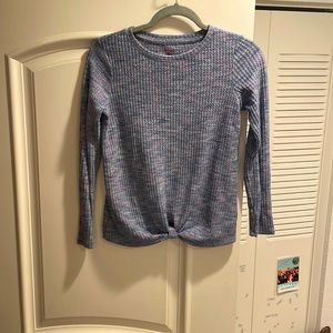 A super soft and cozy purple sweater. Light, not to heavy or thick.
